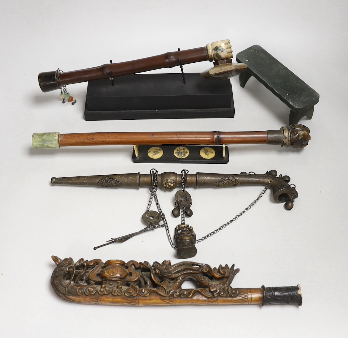 A collection of four Chinese or Indonesian opium pipes, 41.5cm long